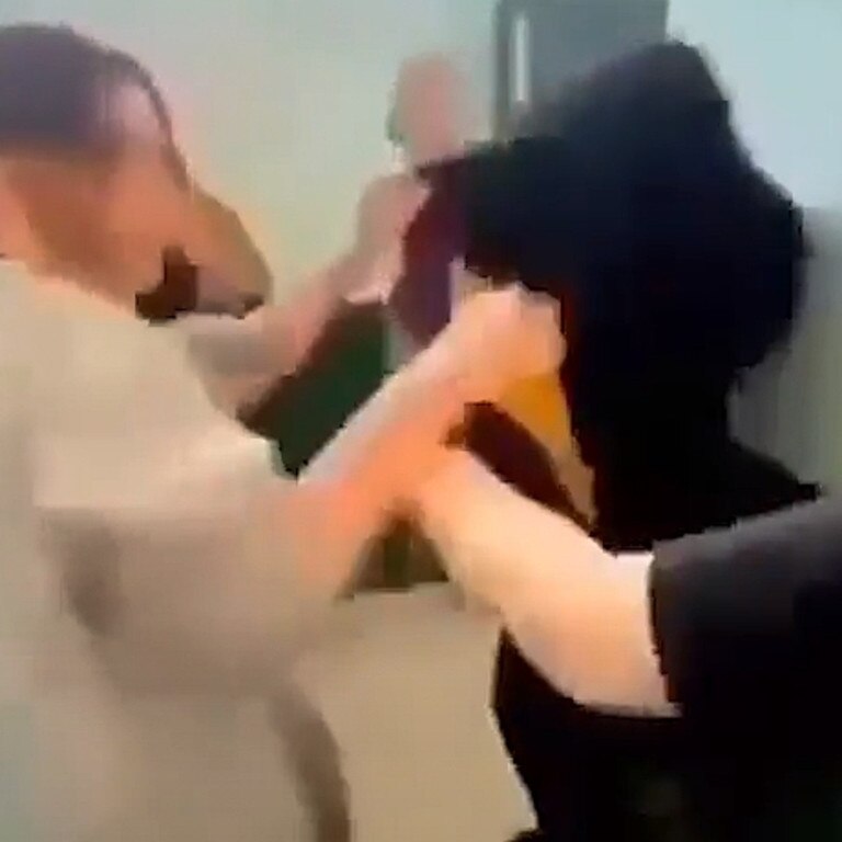 As the two female students exchange punches, other students are heard shouting “keep going”.