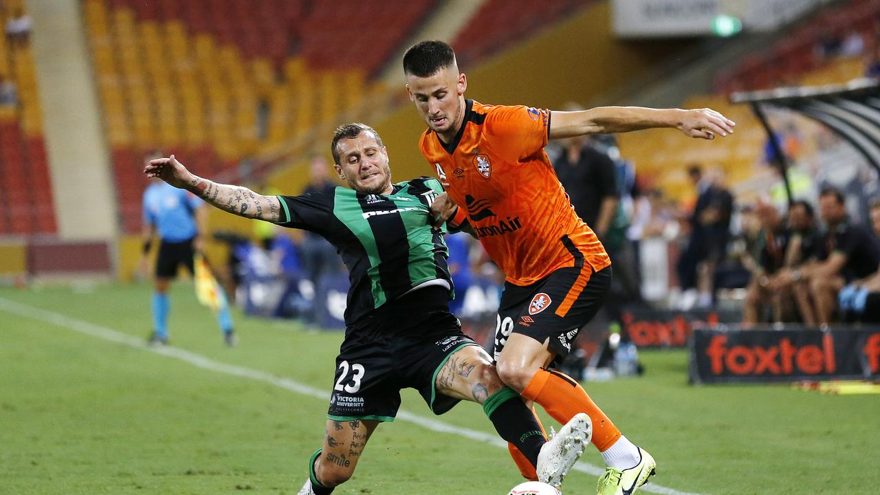 The Roar’s Jordan Courtney-Perkins (right) battles Western United’s Alessandro Diamanti for possession. Picture: AAP Image/Josh Woning