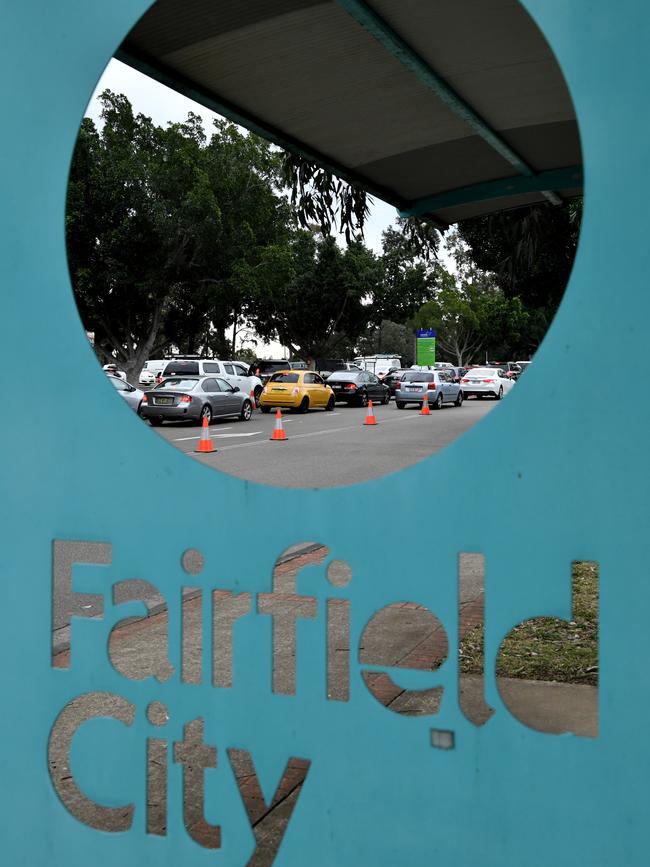 People queue in cars for Covid-19 tests at the Fairfield Showground in southwest Sydney. Picture: Joel Carrett