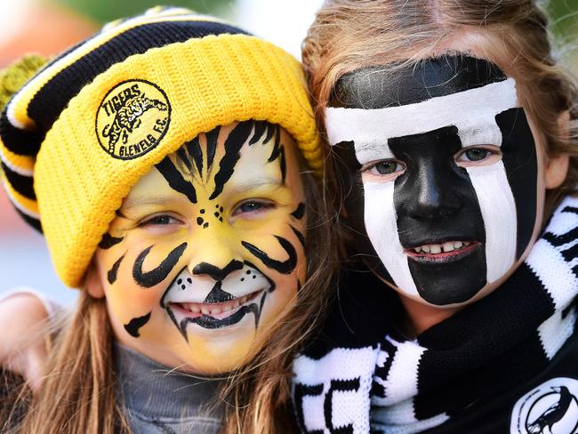 Evie White,5 and Millie Lokan ,5, supporting their dads Port Adelaide coach Matthew Lokan and Glenelg player Jesse White during the Rundle Mall Grand Final Eve Presentations Saturday September 21,2019.(Image AAP/Mark Brake)