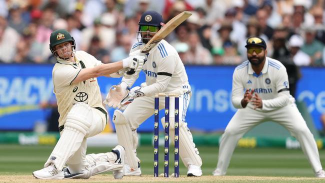 Steve Smith smashes another boundary on his way to a sparkling Test century at the MCG against India on Friday. Picture: Getty Images