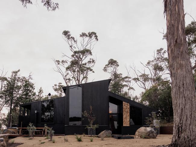 Sisters’s stylish dark timber-clad exterior helps the shack blend into its bush setting. Picture: Supplied