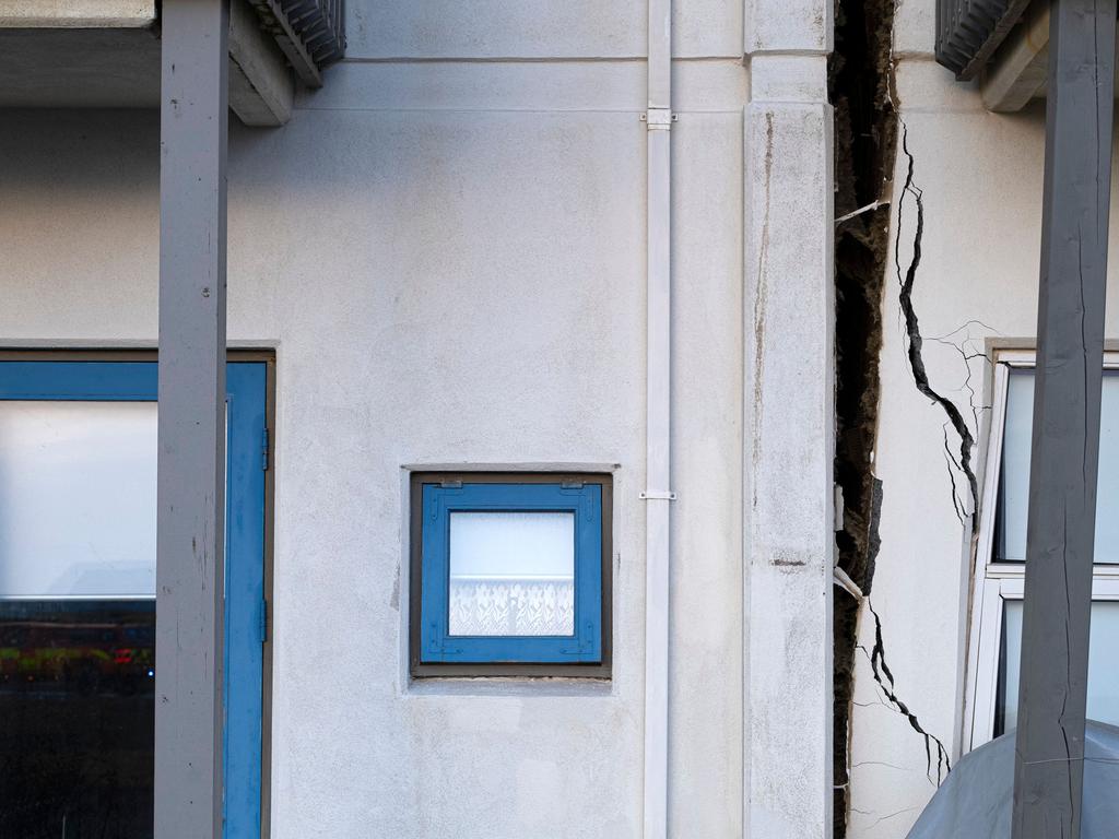 A large crack had cut through the facade of a house in Grindavik by the time this picture was taken on Monday, two days after the evacuation order and state of emergency was declared in the region. Picture: Kjartan Torbjoernsson/AFP/Iceland OUT