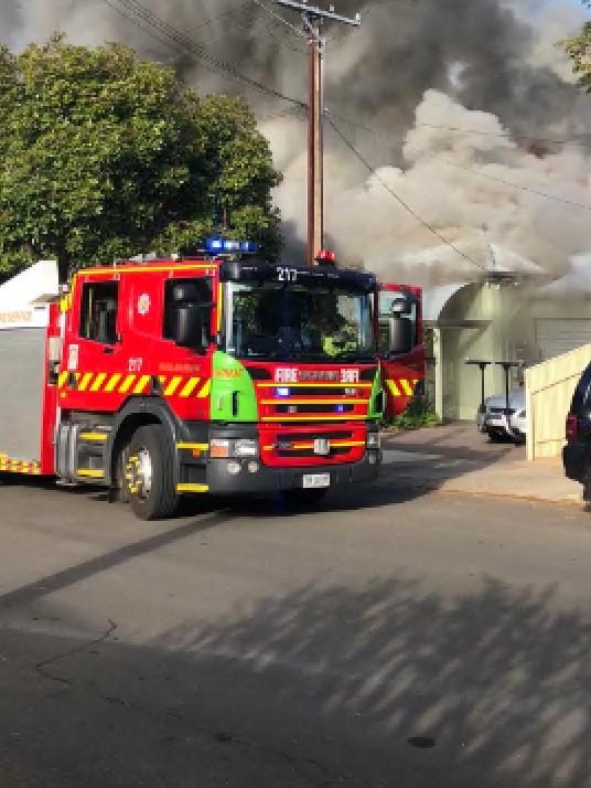 A family of five escaped their burning home at Trinity Gardens. Neighbours on either side also evacuated with fears it would spread. Picture: Kate Lambe/9 News