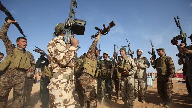 Shia militiamen rally in Iraq’s Anbar province as part of an effort to retake Ramadi. Picture: AFP