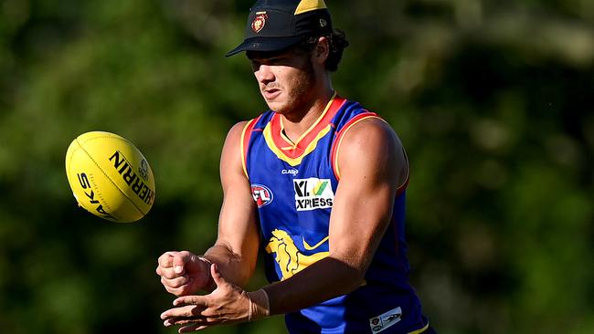 BRISBANE, AUSTRALIA – FEBRUARY 03: Cam Rayner handballs during a Brisbane Lions AFL training session at Yeronga on February 03, 2021 in Brisbane, Australia. (Photo by Bradley Kanaris/AFL Photos/Getty Images)