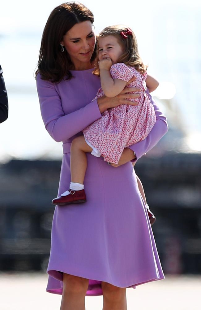 She shared a tender (and impeccably styled) mother-daughter moment on the tarmac with Princess Charlotte. Picture: AFP