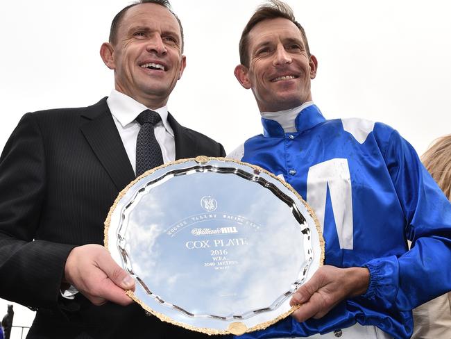 Trainer Chris Waller and Hugh Bowman with the winner’s trophy. Picture: AAP