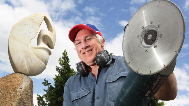 Sculptor Craig Medson with his piece "Flight" for the 2013 Gold Coast Art Festival.