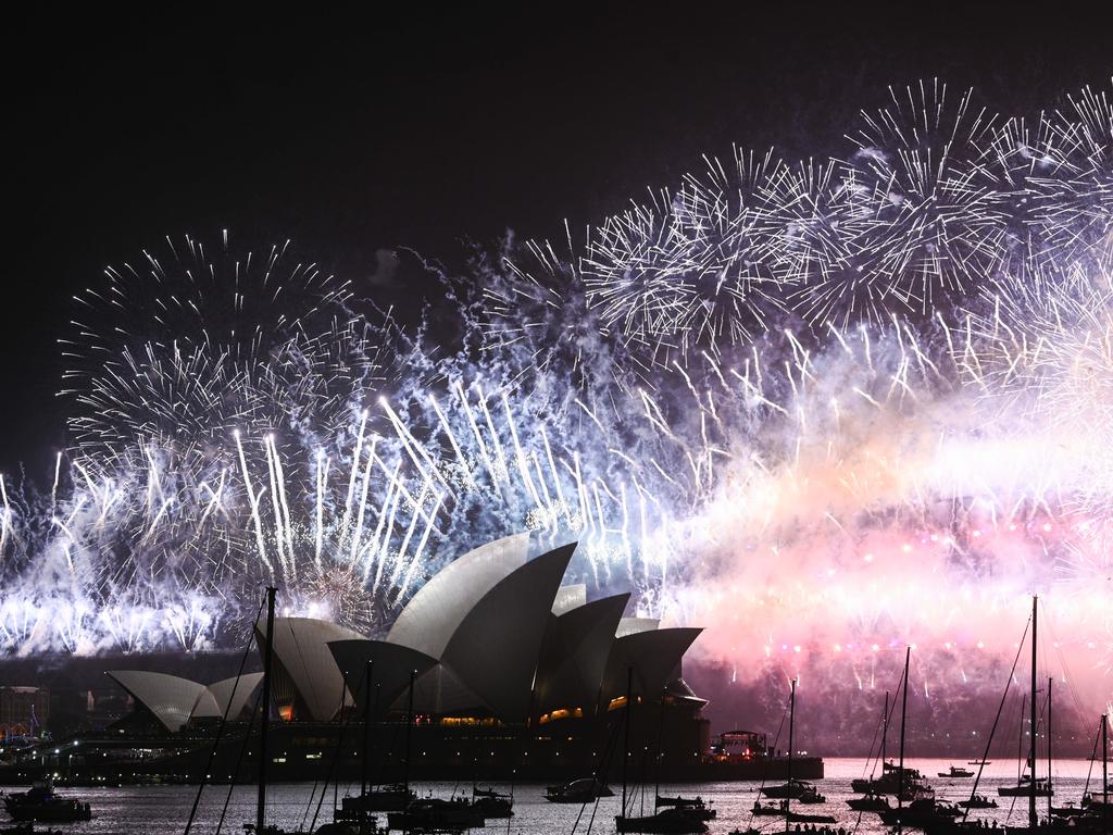 Fireworks explode over the Sydney Harbour Bridge and the Sydney Opera House in the midnight display during New Year's Eve celebrations on January 1, 2020 in Sydney, Australia. (Photo by James Gourley/Getty Images)