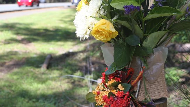 Floral tributes at the scene of the crash that killed a nine-year-old boy at Robina Town Centre Drive on Wednesday.25 October 2024 Robina Picture by Richard Gosling