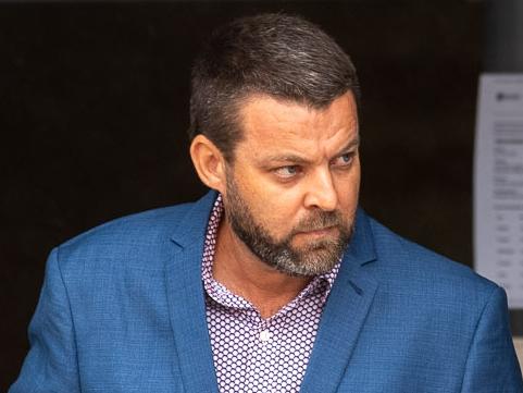 Zane Glenn Petersen (centre, blue suit) leaving Maroochydore Magistrates Court on December 16, 2024. Picture: Sam Turner