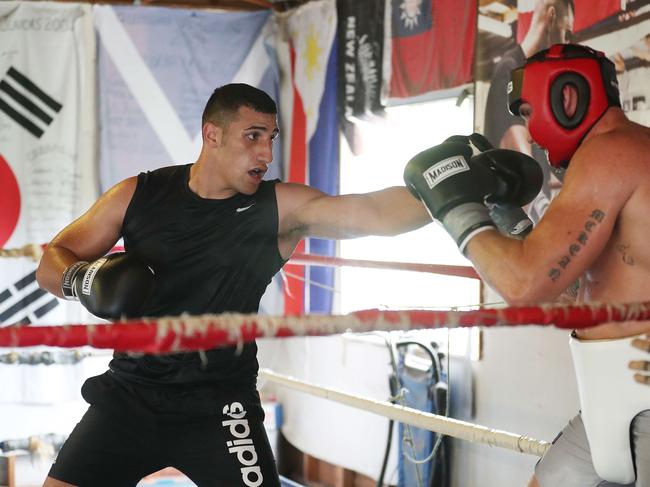 Olympic boxer Justis Huni jabs at top pro Demsey McKean. Picture: Annette Dew