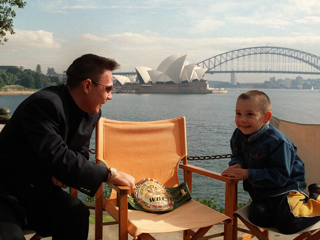 JULY 8, 1999: Boxer Kostya Tszyu with son Tim at Mrs Macquarie Chair overlooking Sydney Harbour. Pic Stephen Cooper. Boxing / Tszy/fam