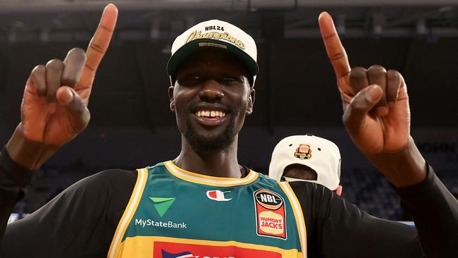 MELBOURNE, AUSTRALIA - MARCH 31: Majok Deng of the JackJumpers celebrates after JackJumpers win game five of the NBL Championship Grand Final Series between Melbourne United and Tasmania JackJumpers at John Cain Arena, on March 31, 2024, in Melbourne, Australia. (Photo by Kelly Defina/Getty Images)