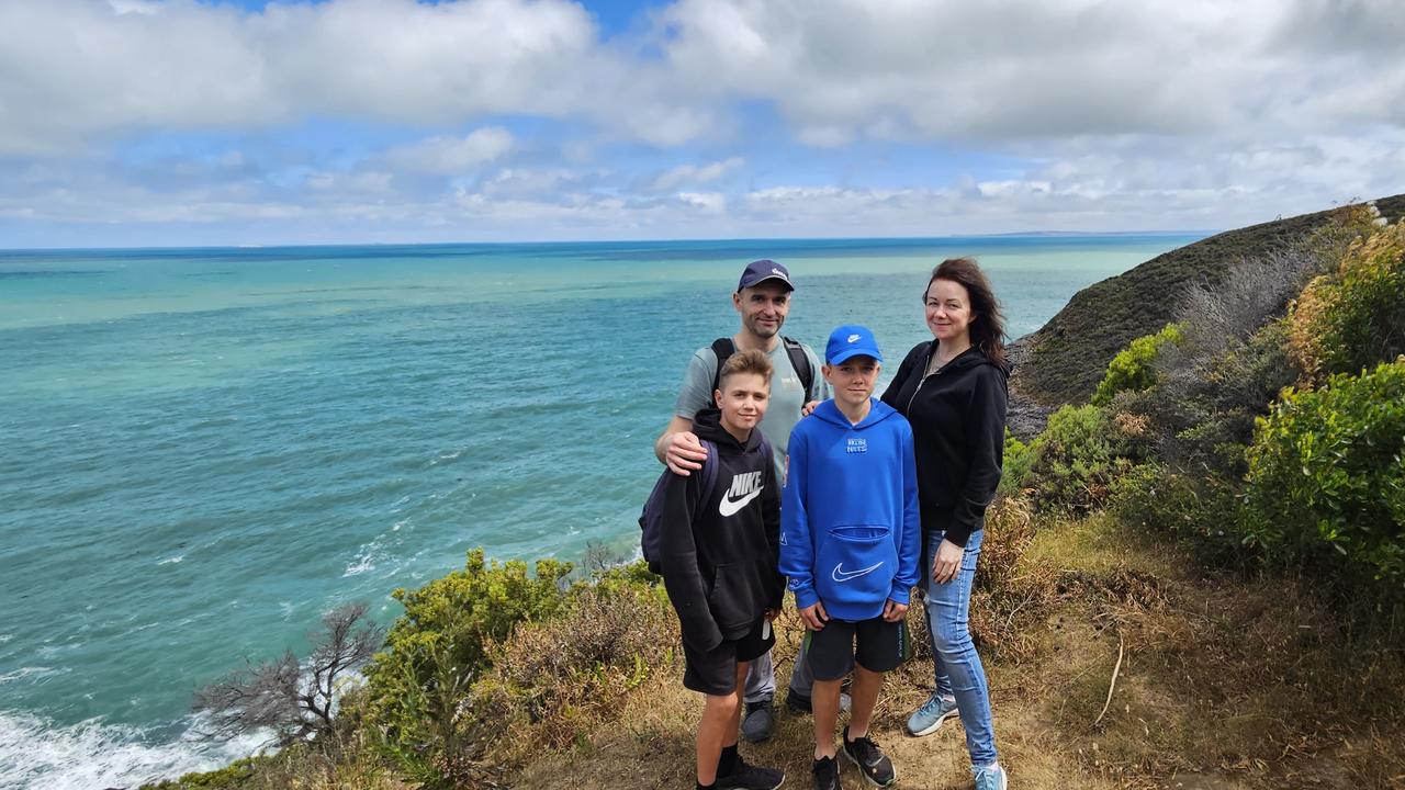 Yaryna and Yuriy Kholodeno, with sons Taras 15, and Nazar, 13. They say their family is happy in Adelaide “being safe”. Picture: Supplied.