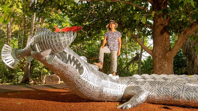 Artist Techy Masero with the 9m long crocodile sculpture at the George Brown Darwin Botanic Gardens. Picture: Che Chorley