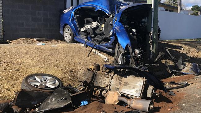 The car collided with a power pole on the corner of Benowa Road and Heeb Street at Ashmore.