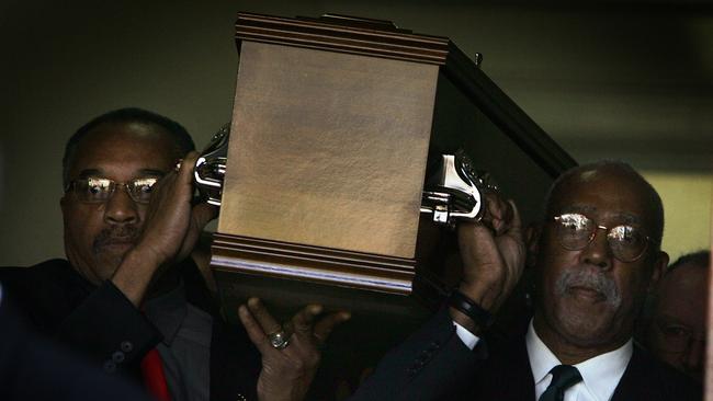 Tommie Smith, left, and John Carlos (1968 Mexico Olympics Gold and Bronze medallist) carry the coffin of Peter Norman at his funeral in Melbourne in 2006.