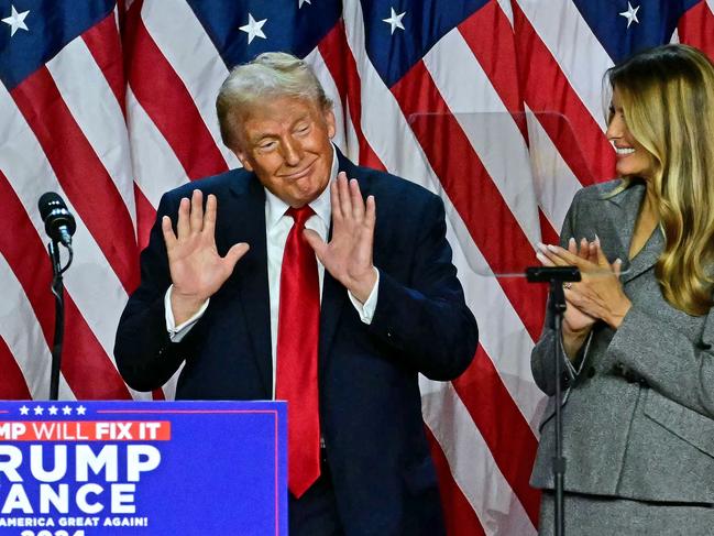 TOPSHOT - Former US President and Republican presidential candidate Donald Trump gestures after speaking during an election night event at the West Palm Beach Convention Center in West Palm Beach, Florida, on November 6, 2024. Republican former president Donald Trump closed in on a new term in the White House early November 6, 2024, just needing a handful of electoral votes to defeat Democratic Vice President Kamala Harris. (Photo by Jim WATSON / AFP)