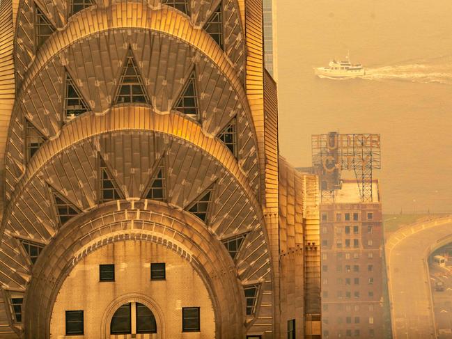 NEW YORK, NEW YORK - JUNE 7: The Chrysler Building is covered in a smoky haze from wildfires in Canada as it blankets Manhattan on June 7, 2023 in New York City. New York topped the list of most polluted major cities in the world on Tuesday night, as smoke from the fires continues to blanket the East Coast.   David Dee Delgado/Getty Images/AFP (Photo by David Dee Delgado / GETTY IMAGES NORTH AMERICA / Getty Images via AFP)