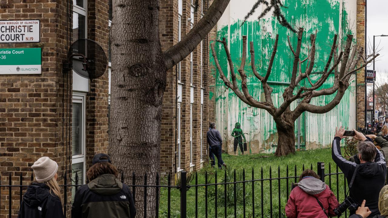 The green paint Banksy used for the foliage effect matches the colour the local council in the urban borough of Islington uses on the area’s road signs. Picture: Dan Kitwood/Getty Images