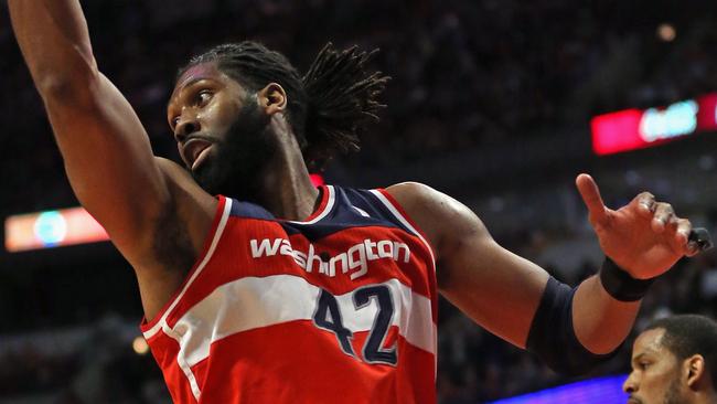 CHICAGO, IL - APRIL 22: Nene #42 of the Washington Wizards rebounds against the Chicago Bulls in Game Two of the Eastern Conference Quarterfinals during the 2014 NBA Playoffs at the United Center on April 22, 2014 in Chicago, Illinois. The Wizards defeated the Bulls 101-99. NOTE TO USER: User expressly acknowledges and agrees that, by downloading and or using this photograph, User is consenting to the terms and conditions of the Getty Images License Agreement. (Photo by Jonathan Daniel/Getty Images)