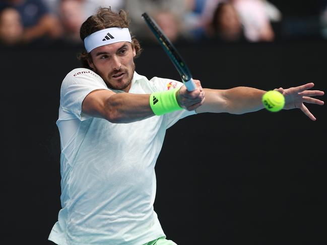 Stefanos Tsitsipas of Greece plays a forehand in their round three singles match against Luca Van Assche of France. Picture: Phil Walter/Getty Images