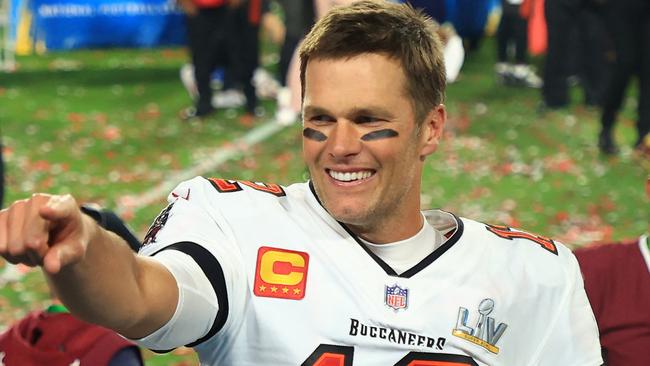 (FILES) In this file photo taken on February 07, 2021, Tom Brady of the Tampa Bay Buccaneers celebrates after defeating the Kansas City Chiefs in Super Bowl LV at Raymond James Stadium in Tampa, Florida. - Brady has agreed to a contract extension with the Tampa Bay Buccaneers that will enable the Super Bowl champions to keep other top players, according to multiple reports on March 12, 2021. (Photo by Mike Ehrmann / GETTY IMAGES NORTH AMERICA / AFP)