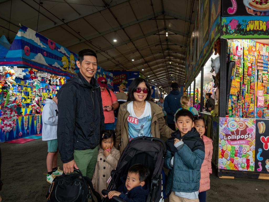 51 pics: Ekka-goers brave big wet on day 3 | The Courier Mail