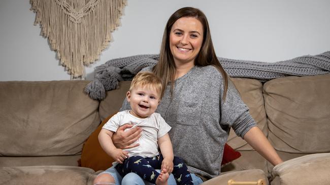 Krystal Mackintosh with her second child Angus, 8 months, at home in Morphett Vale, SA. Picture: NCA NewsWire / Emma Brasier