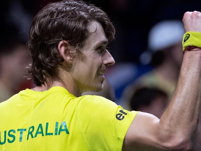 Australiaâs Alex De Minaur celebrates after winning the men's single quarter-final tennis match between Australia and Netherlands of the Davis Cup tennis tournament at the Martin Carpena sportshall, in Malaga on November 22, 2022. (Photo by JORGE GUERRERO / AFP)