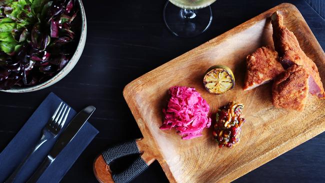 Delicious veal schnitzel at Many Little in Red Hill. Picture: Rebecca Michael