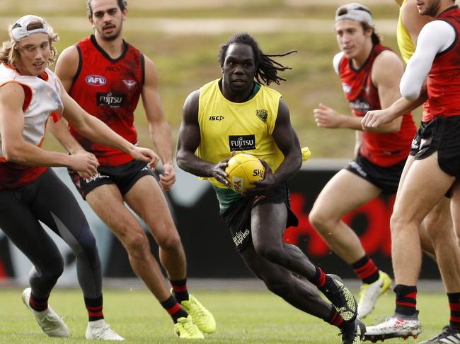 Essendon Bombers player Anthony McDonald-Tipungwuti (centre) is seen during a team training session at the Hangar in Melbourne, Wednesday, May 23, 2018. (AAP Image/Daniel Pockett) NO ARCHIVING