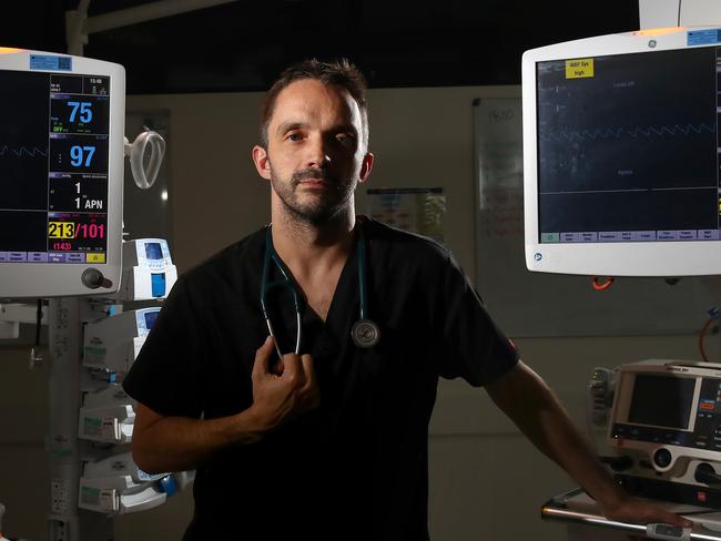 The Night Watch - ED Dr Tom Wallis pictured in the emergency department of the Northern Beaches Hospital. He has been on the Covid-19 frontline, setting up clinics and treating patients. Picture: Toby Zerna