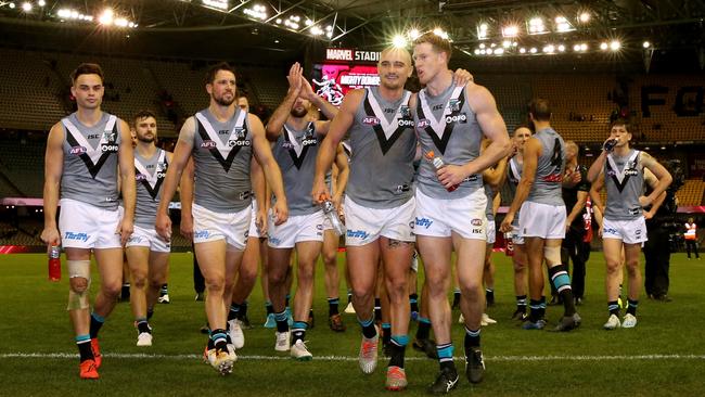 The Power celebrate their win against Essendon at Marvel Stadium in Melbourne on Saturday. Picture: AAP Image/Mark Dadswell