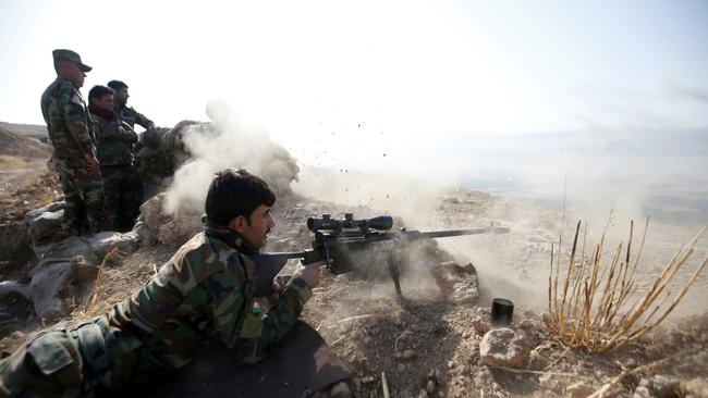 A member of the Iraqi forces holds a position in the al-Shura area, south of Mosul, during the operation to retake the main hub city from the Islamic State.