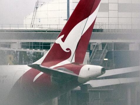 A Qantas Airways Ltd. aircraft on the tarmac at Sydney Airport in Sydney, Australia, on Wednesday, July 6, 2022. Qantas, which carries the slogan "Spirit of Australia," has become a punching bag for passengers exasperated with canceled flights, lost belongings and unscheduled sleepovers on airport floors. Photographer: Brent Lewin/Bloomberg