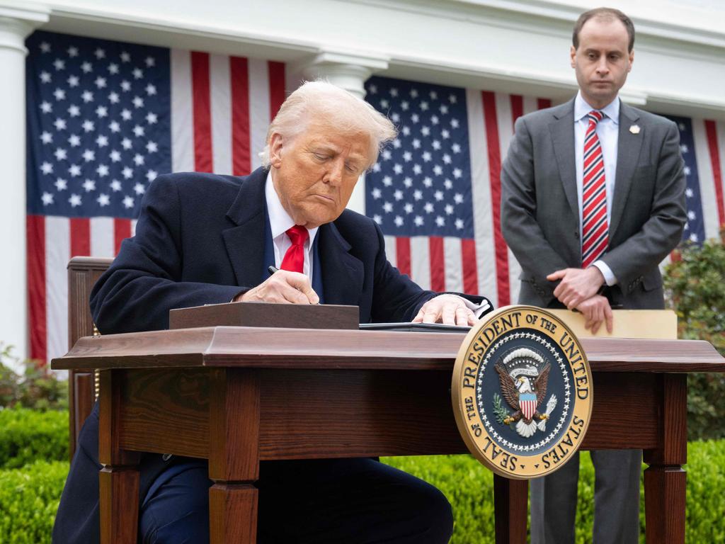 US President Donald Trump signs an executive order after delivering remarks on reciprocal tariffs. Picture: AFP