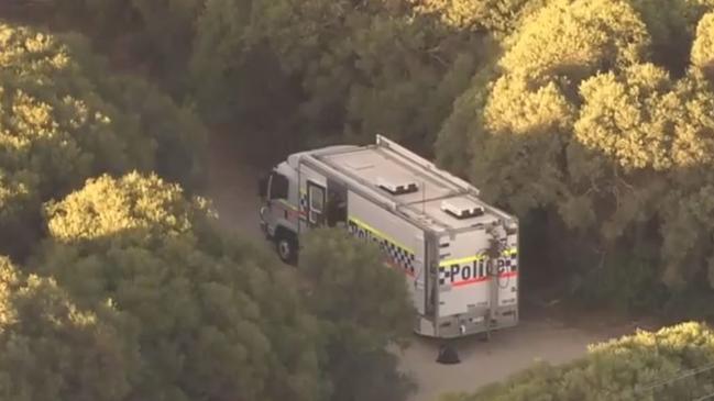 Police search bushland in Warnbro on March 15, 2021 believed to be linked to the killing of Rebels bikie boss Nick Martin. Picture: 9 News