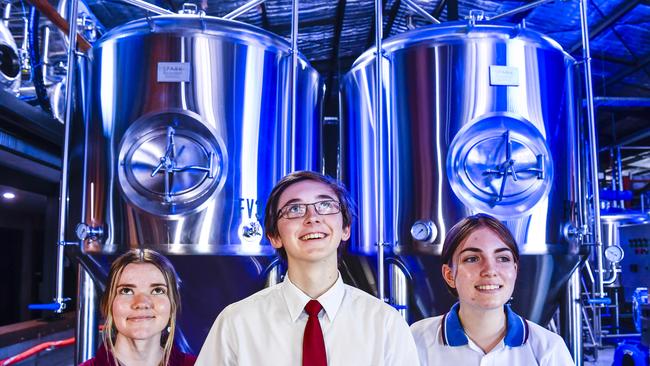 McAuley Catholic College students Mia Pitt, Jack Hay and Breanna Fischer get a look at operations at Sanctus Brewing in Townsend.