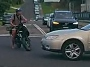 A still from a car dashcam video showing a near collision between an e-bike and a car at the corner of Griffith and Pitt roads at North Curl Curl on February 2, 2025.