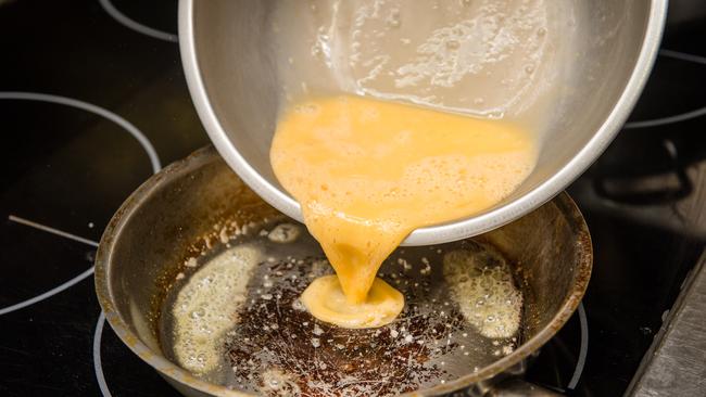 Lightly whisk your eggs, then add to a salted pan on medium heat, where a knob of butter has just started to bubble. Picture: Eugene Hyland