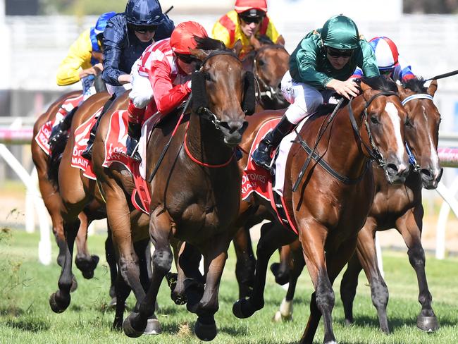Catchy (centre) swoops on Pariah to win the Blue Diamond Stakes in February. Picture: AAP