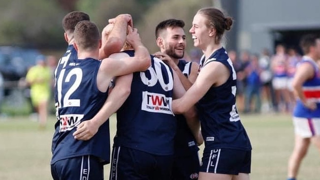 Avondale Heights players get around debutant Jalen Gill. Picture: Marc Gianfriddo