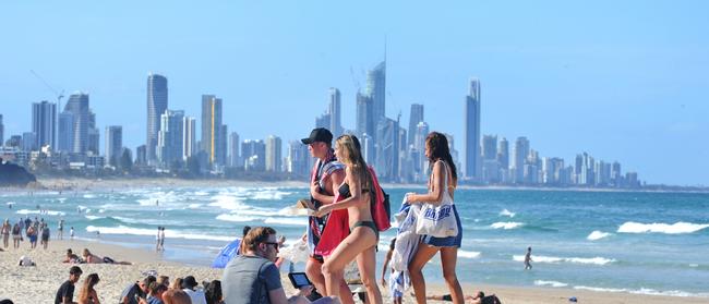 People wear sunscreen at the beach, but will they wear a sticker that tells them when it is not working? (AAP image, John Gass)