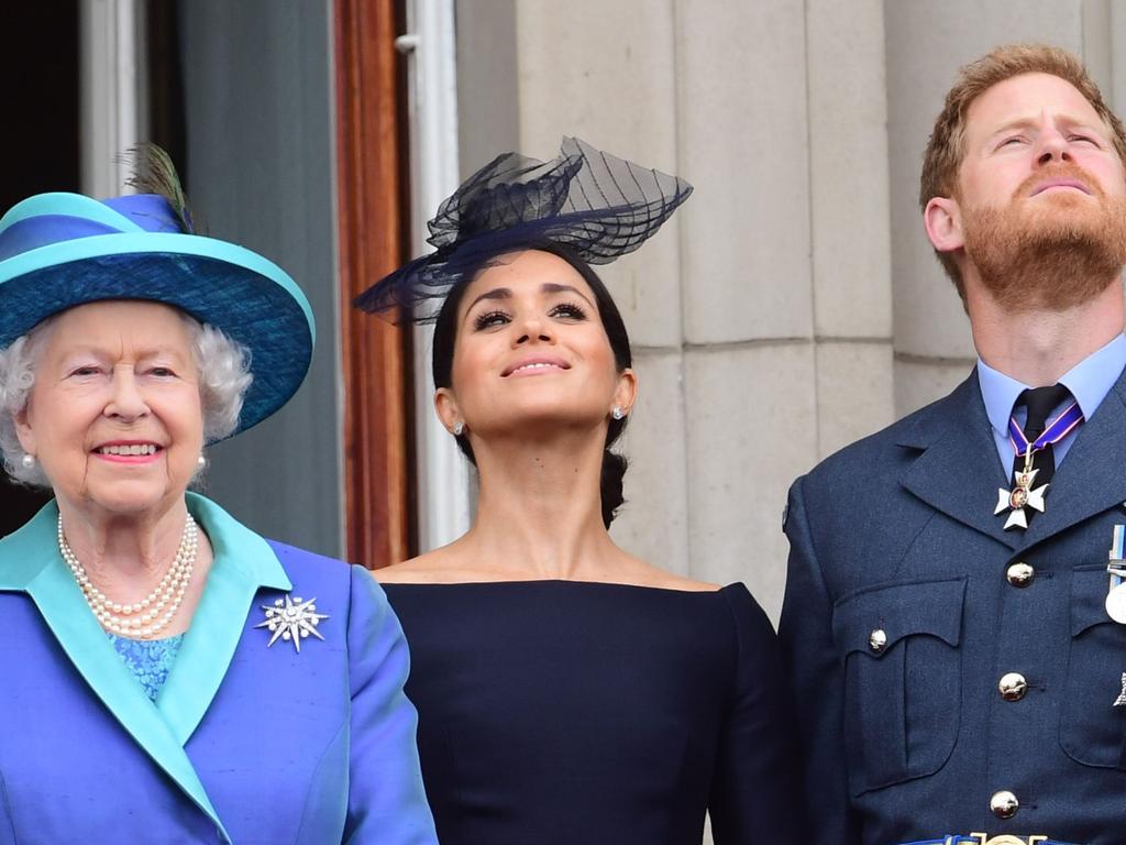 Queen Elizabeth II, Meghan, Duchess of Sussex and Prince Harry, Duke of Sussex, in 2018.