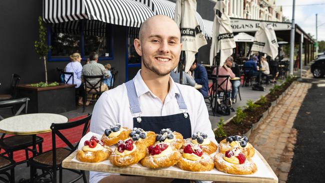 Oliver Hinds with delicious treats from patisserie My Little Blueberry at Nolan’s Block in Crows Nest. Picture: Kevin Farmer