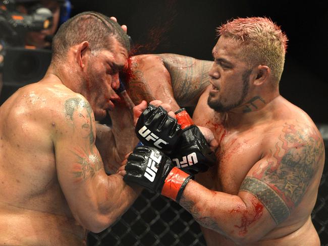 Mark Hunt connects with an elbow during his epic bout against Antonio “Bigfoot” Silva.