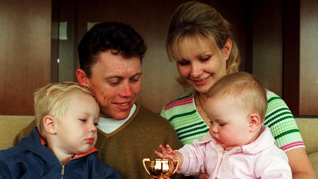 Chris Munce with wife Cathy and kids Corey and Caitlin after returning home following his Melbourne Cup win on Jezabeel.